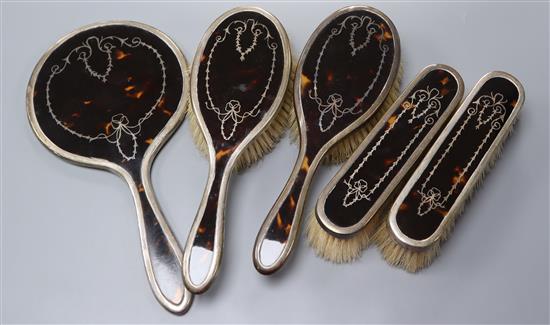 A 1920s silver and tortoiseshell five piece mirror and brush set by Mappin & Webb.